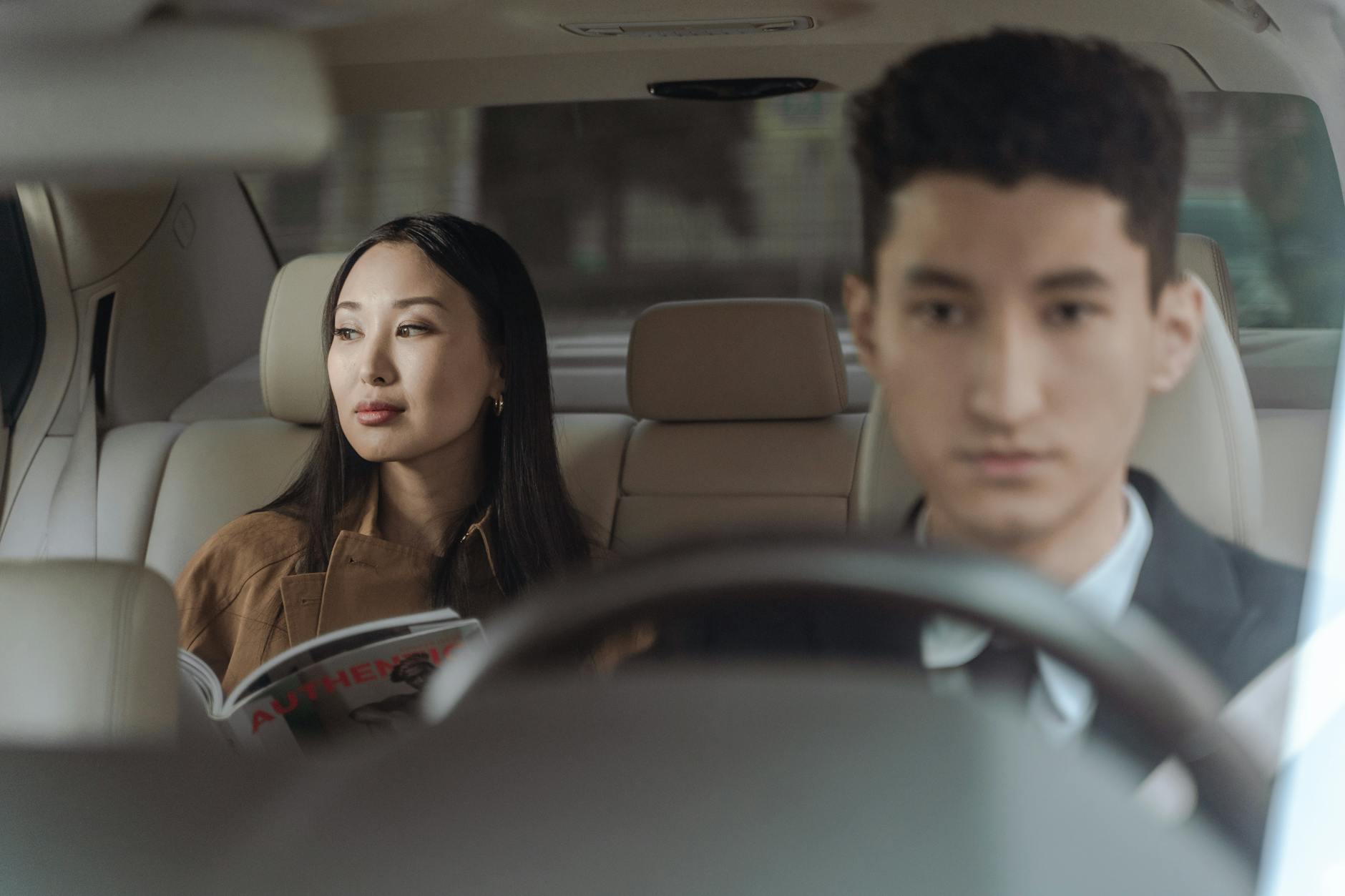 man and woman sitting inside car